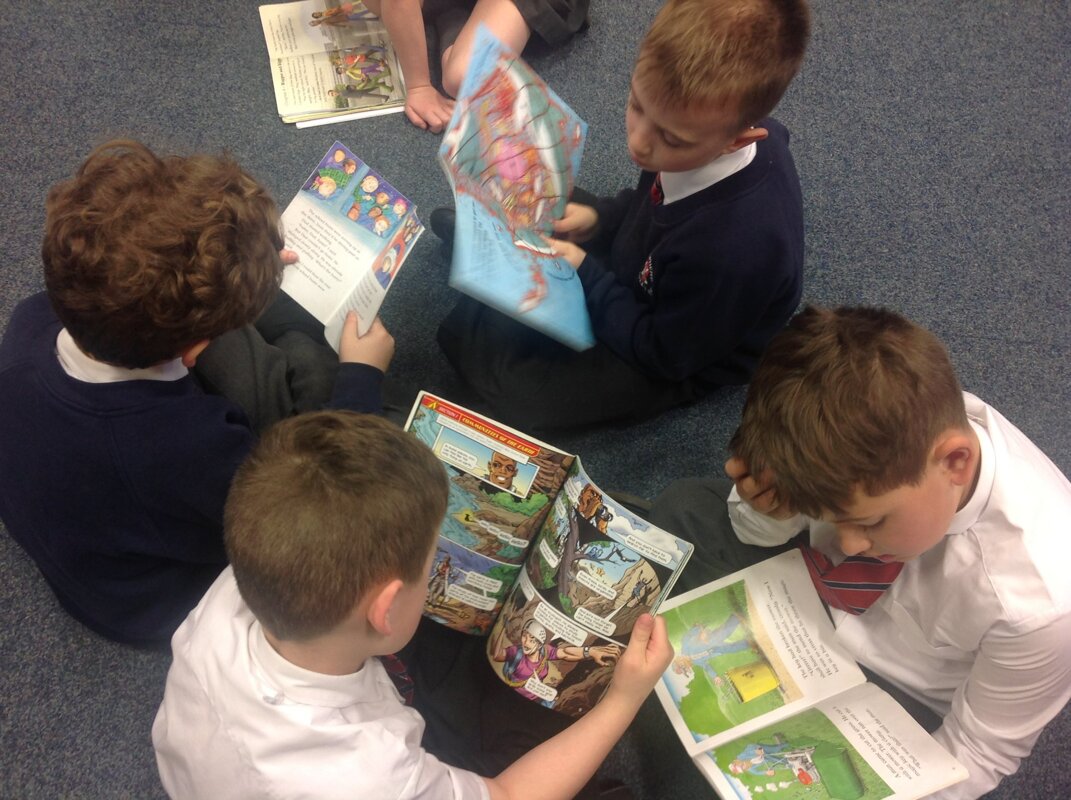 Image of Boys plus books equals an awesome sight!
